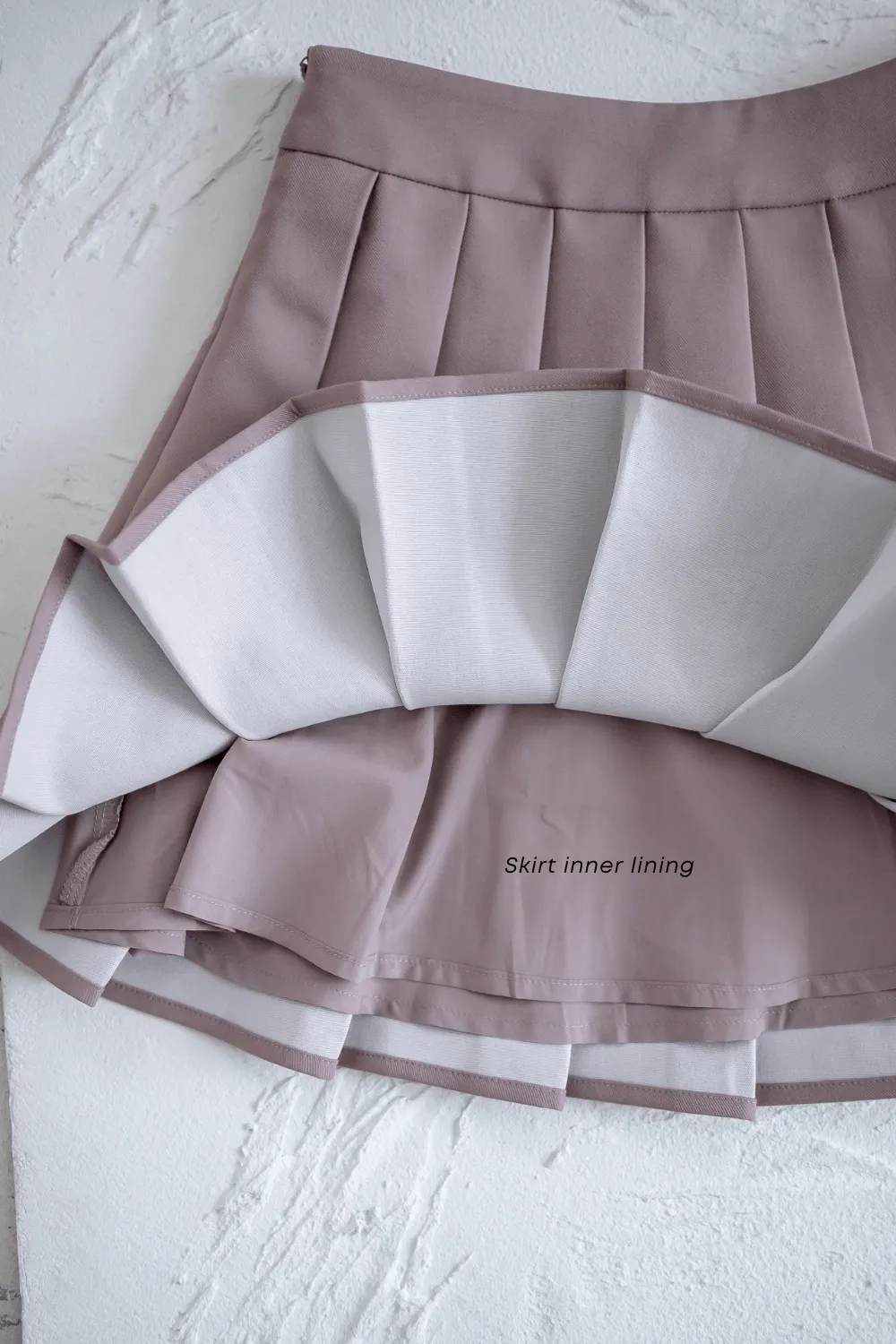 CAMU PLEATED SKIRT IN MAUVE