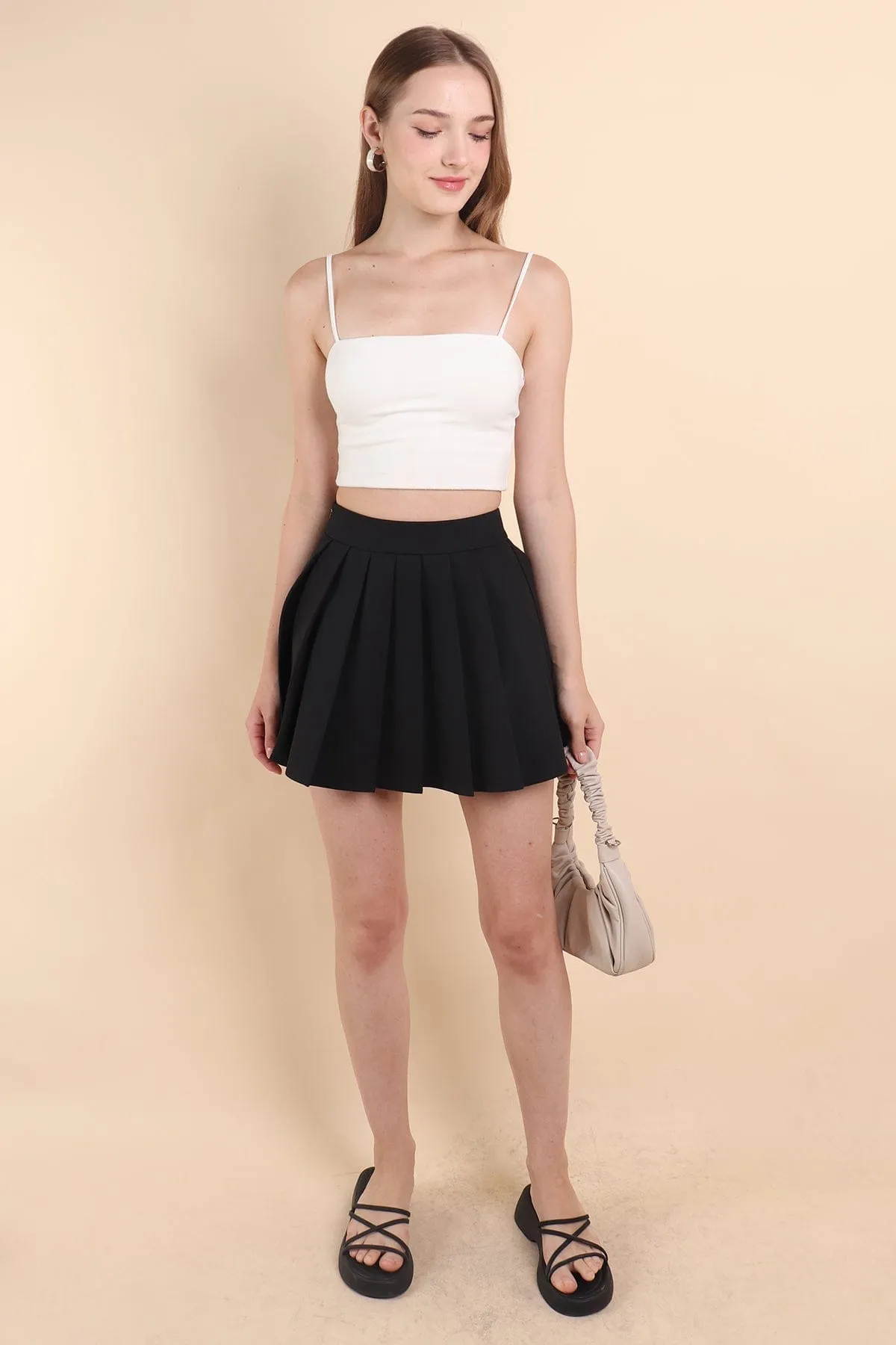 RESTOCKED** CAMU PLEATED SKIRT IN BLACK