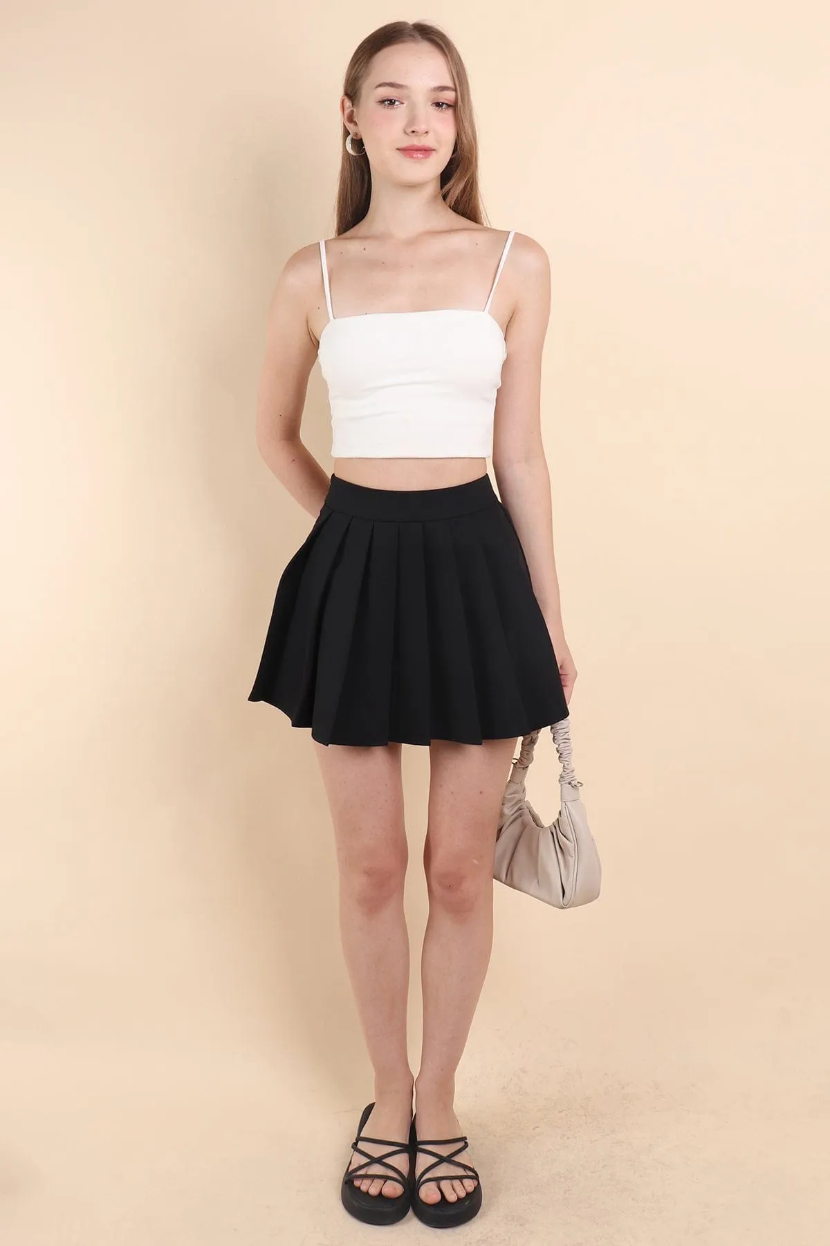 RESTOCKED** CAMU PLEATED SKIRT IN BLACK